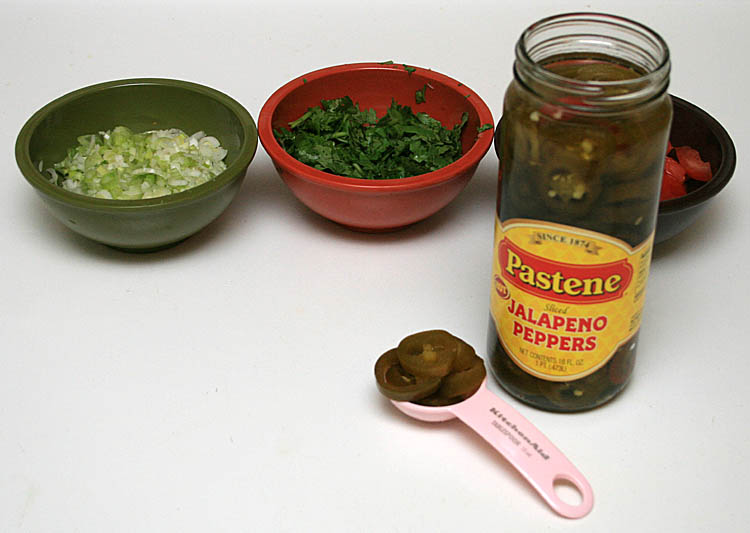6. Take a spoon of sliced jalapeno peppers. If you like it hot you can use more or you can use more of the juice 6. Take a spoon of sliced jalapeno peppers. If you like it hot you can use more or you can use more of the juice