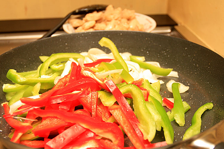 9. Put there onion and peppers and cook for about 5 minutes. Once in a while toss the vegetable.